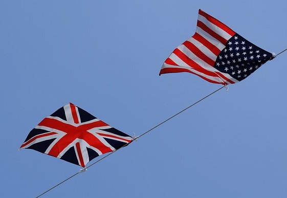 UK and USA flags waving